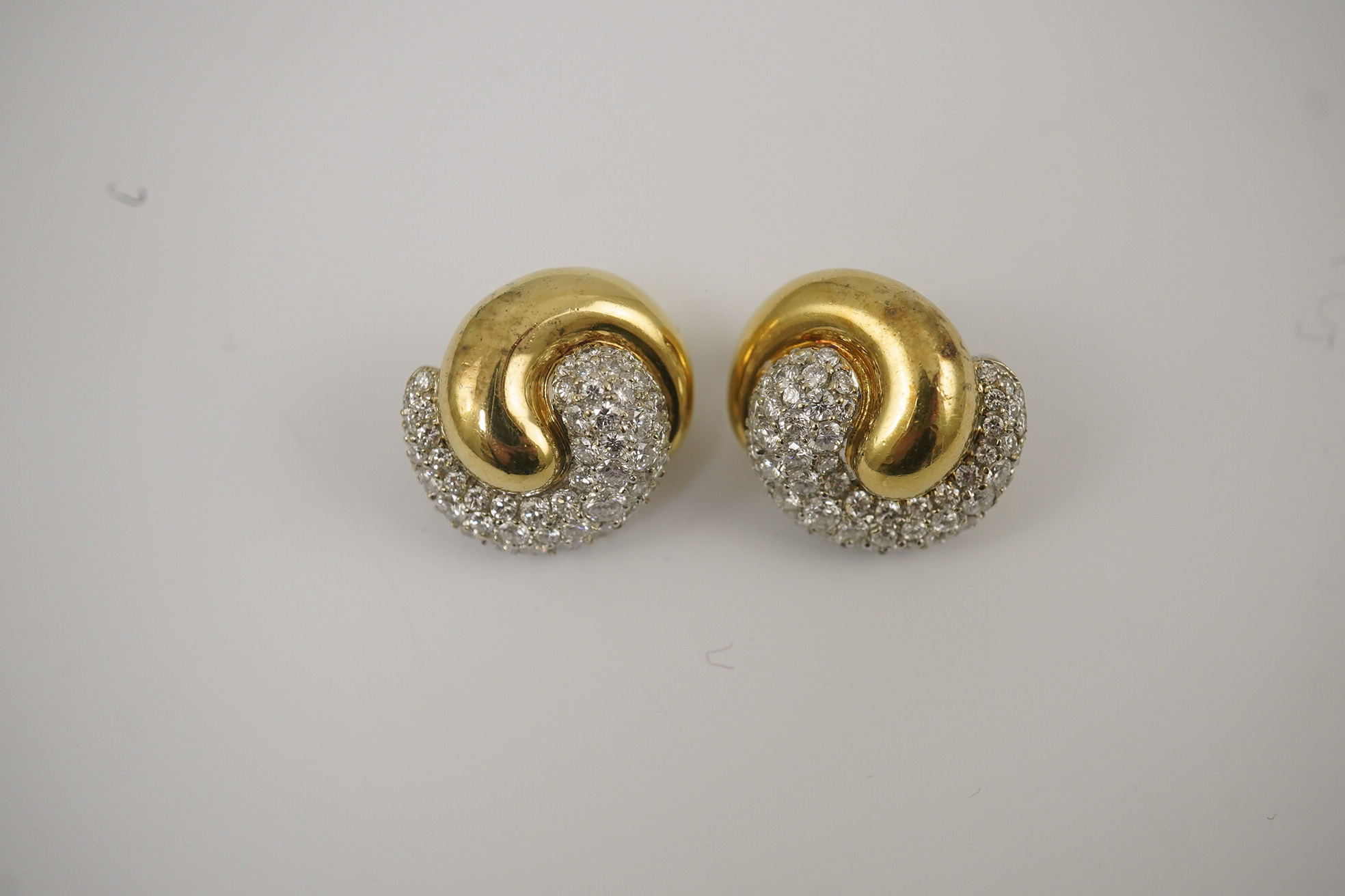 A modern pair of Mappin & Webb 18ct gold and diamond cluster set 'ying and yang' earrings